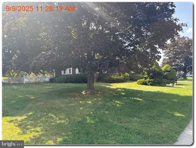 a view of yard with swimming pool
