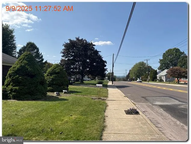 a swimming pool with trees in the background