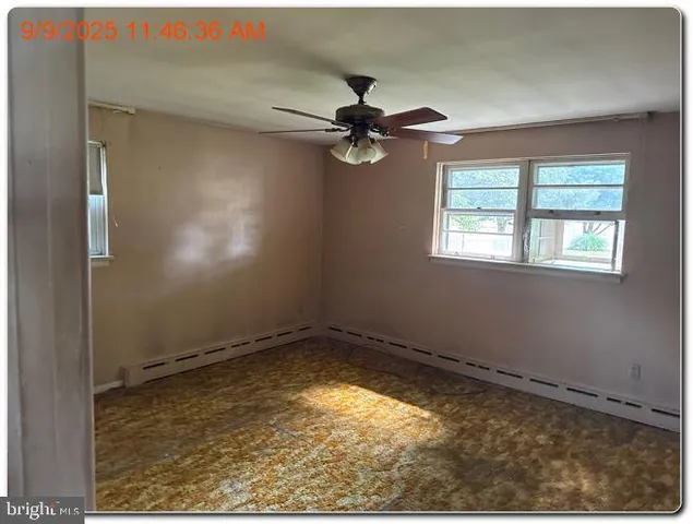 an empty room with windows