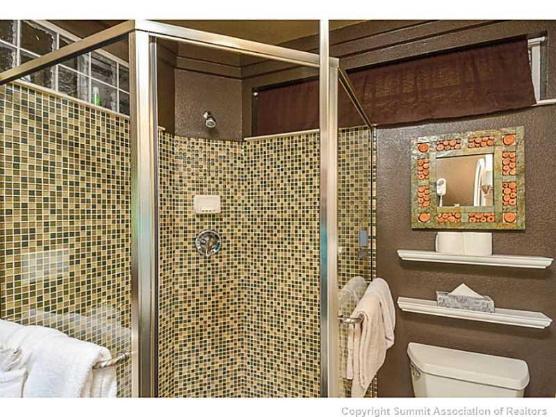 1944 Soda Ridge Road, Unit 1229 Keystone, CO 80435 - Photo 13 of 17 a bathroom with a toilet and shower
