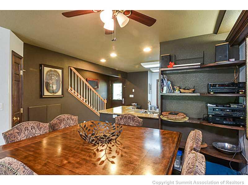 1944 Soda Ridge Road, Unit 1229 Keystone, CO 80435 - Photo 4 of 17 a kitchen with kitchen island granite countertop a stove and cabinets