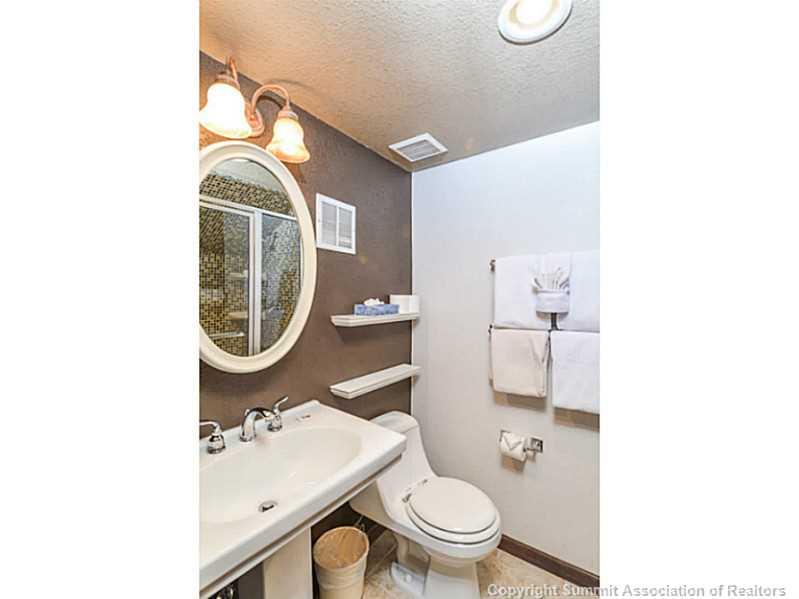 1944 Soda Ridge Road, Unit 1229 Keystone, CO 80435 - Photo 8 of 17 a bathroom with a toilet a sink and a mirror