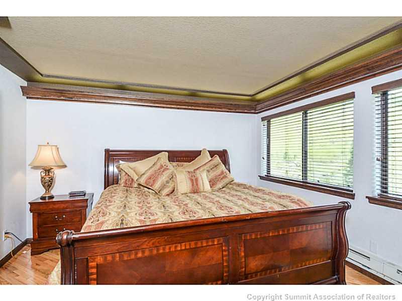 1944 Soda Ridge Road, Unit 1229 Keystone, CO 80435 - Photo 10 of 17 a bedroom with a bed and a window