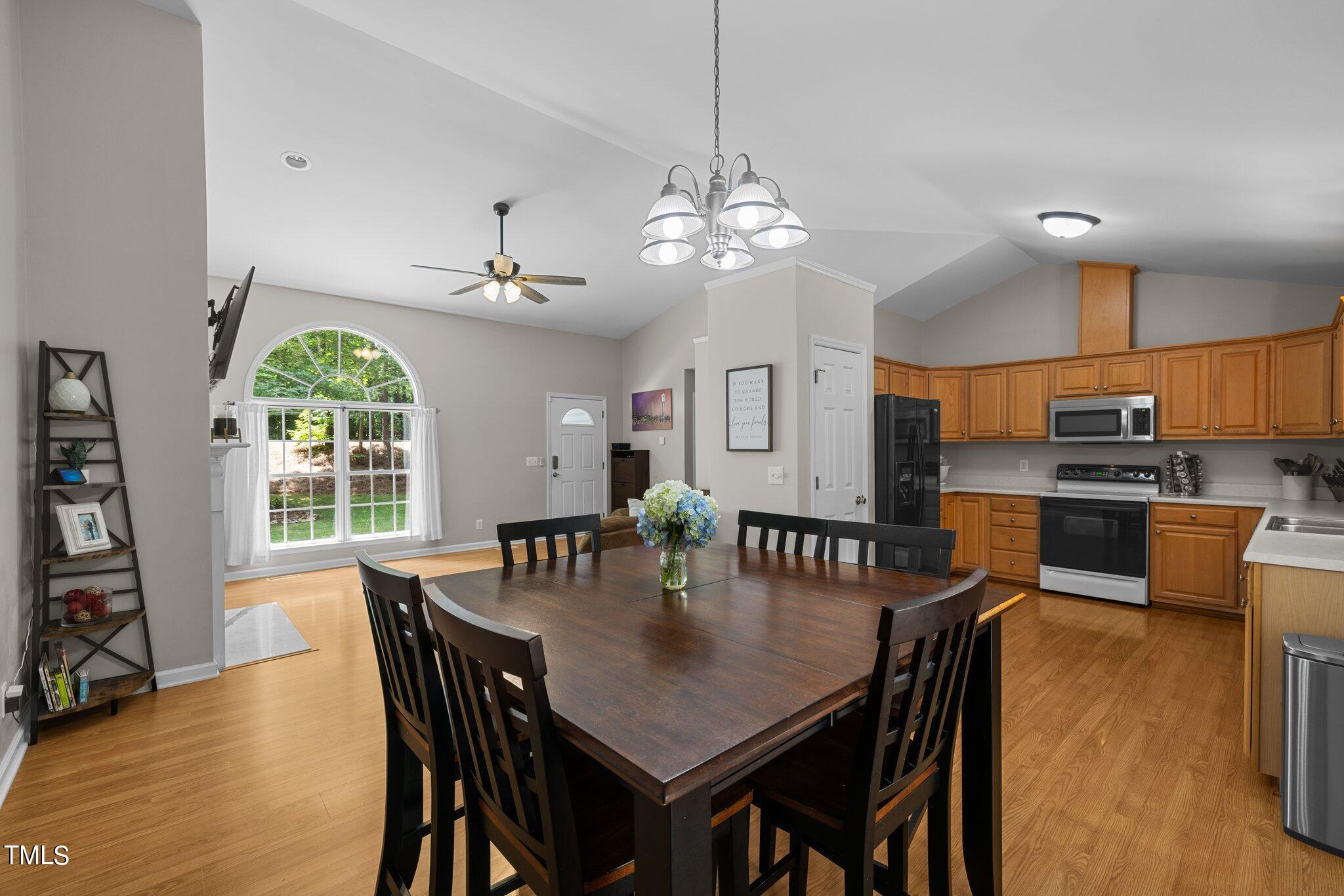7031 Calais Drive Durham, NC 27712 - Photo 12 of 48 a view of a dining room with furniture window and outside view