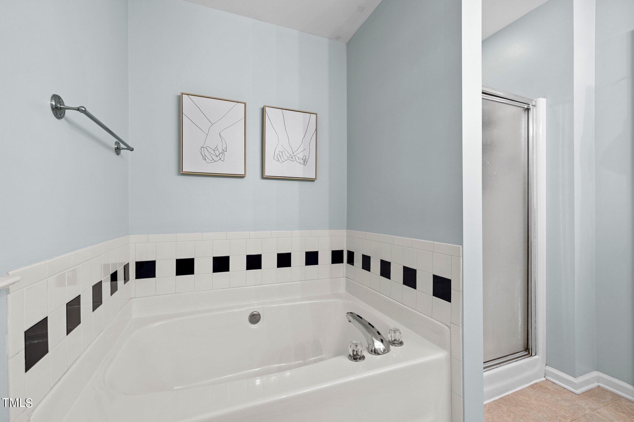 7031 Calais Drive Durham, NC 27712 - Photo 21 of 48 a bathroom with bathtub
