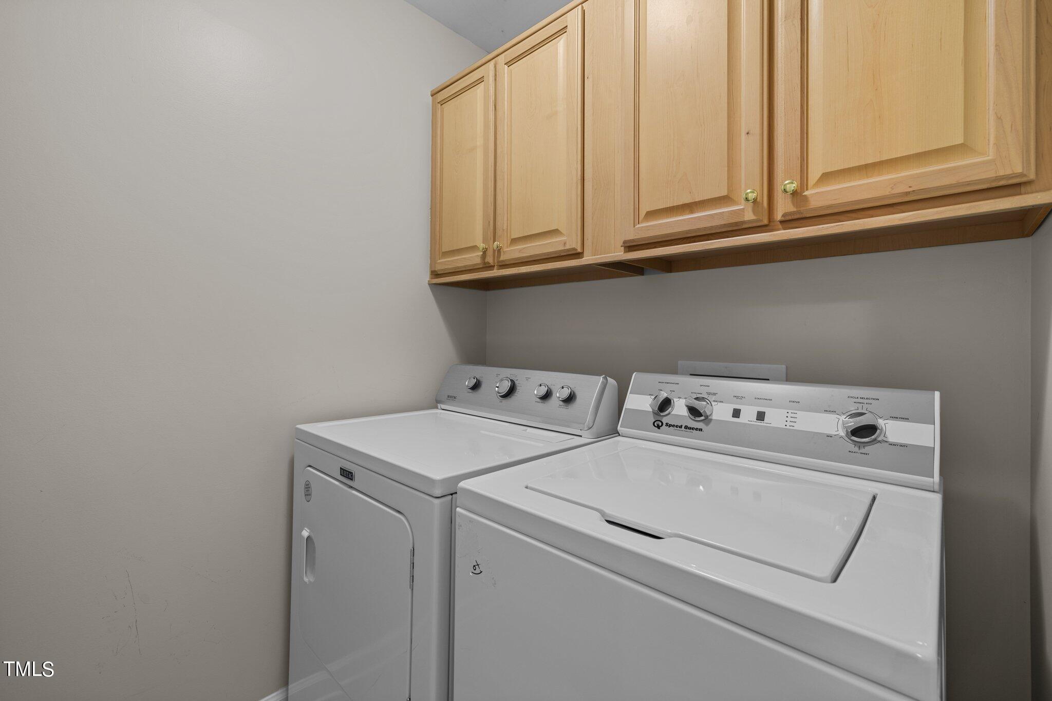 7031 Calais Drive Durham, NC 27712 - Photo 26 of 48 a utility room with dryer and washer