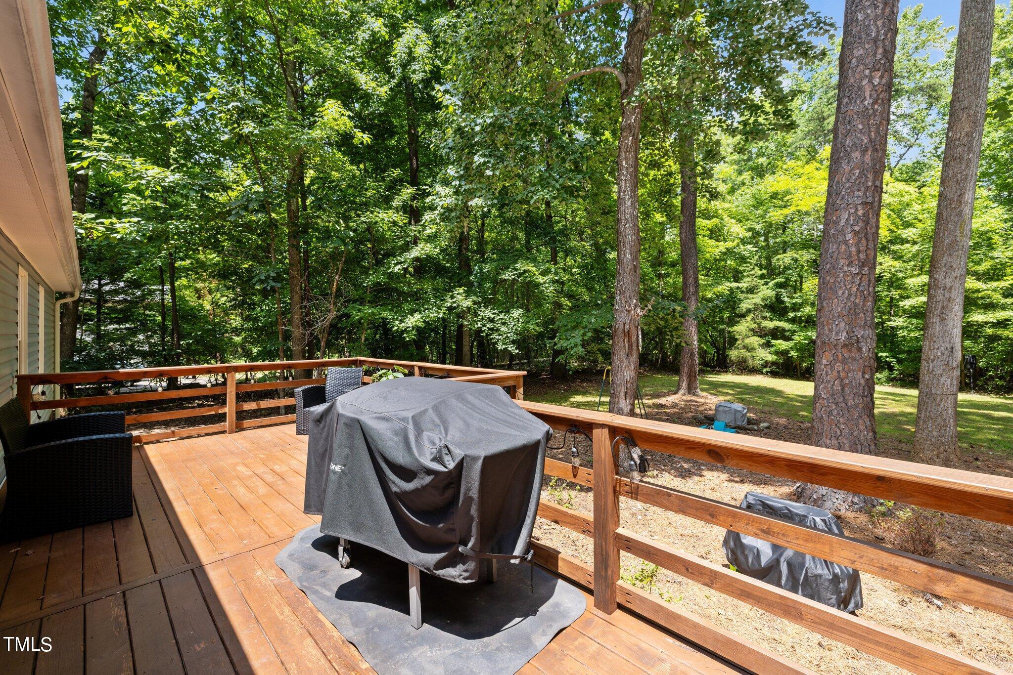 7031 Calais Drive Durham, NC 27712 - Photo 27 of 48 a view of balcony with wooden floor and outdoor seating