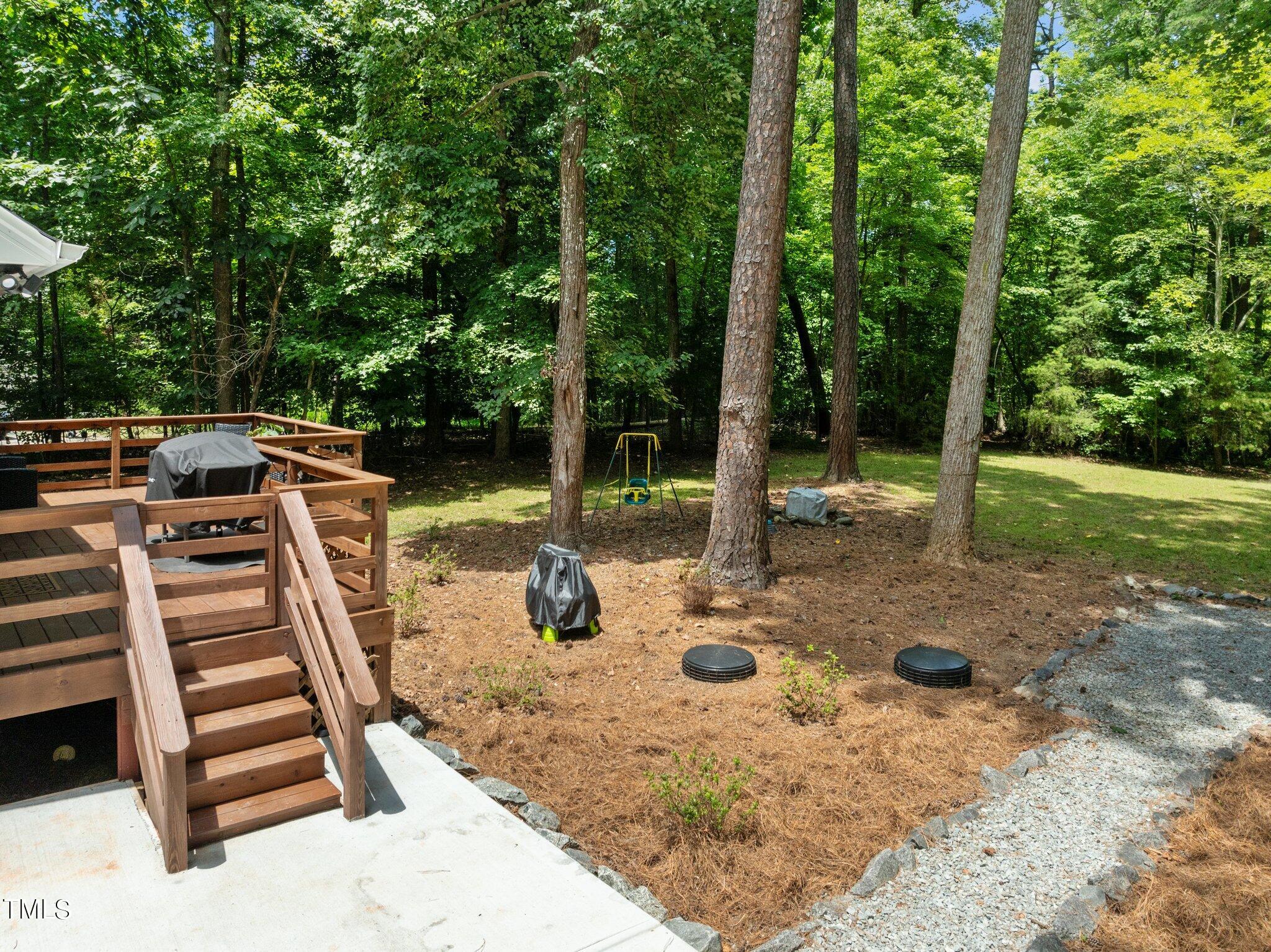7031 Calais Drive Durham, NC 27712 - Photo 29 of 48 a view of a backyard with sitting area