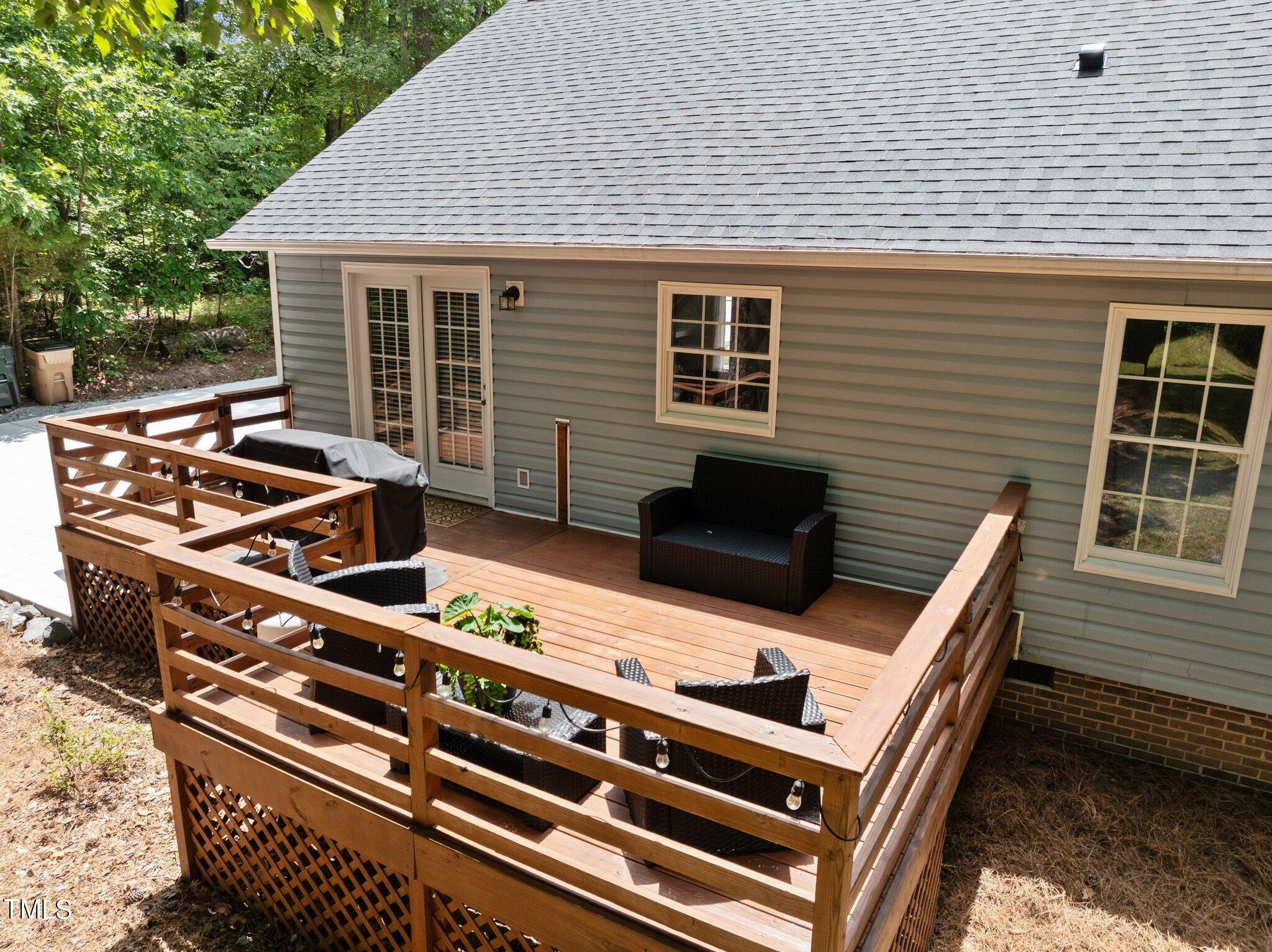 7031 Calais Drive Durham, NC 27712 - Photo 31 of 48 a view of a roof deck with wooden floor and fence