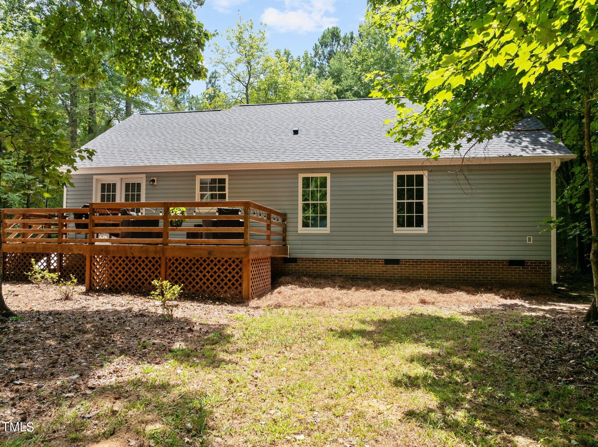 7031 Calais Drive Durham, NC 27712 - Photo 32 of 48 a view of a house with a yard