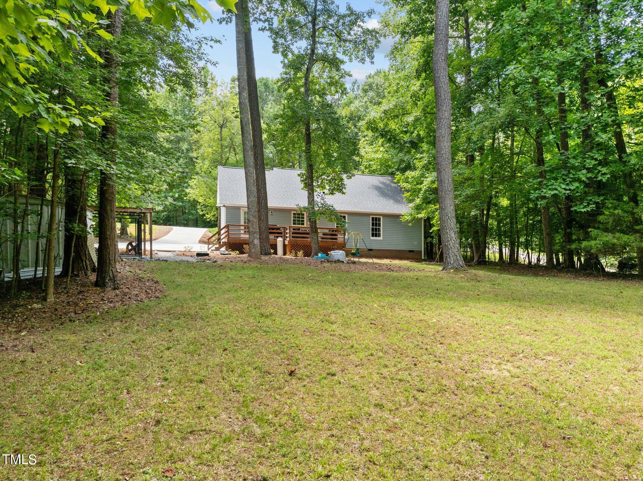 7031 Calais Drive Durham, NC 27712 - Photo 39 of 48 a view of house with outdoor space