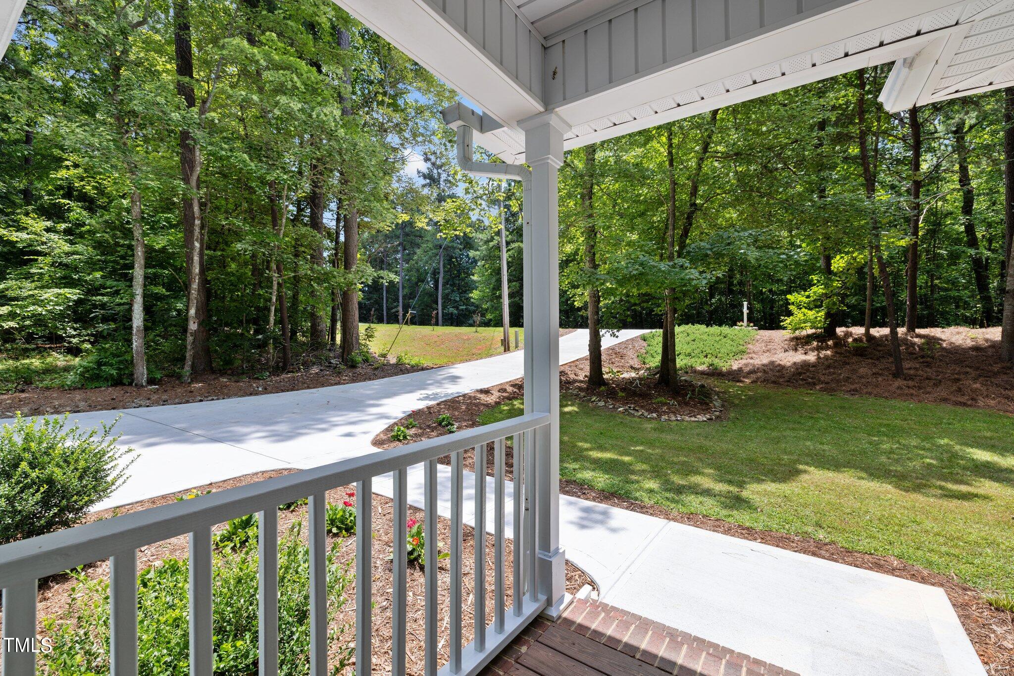 7031 Calais Drive Durham, NC 27712 - Photo 4 of 48 a view of a wooden deck with a yard