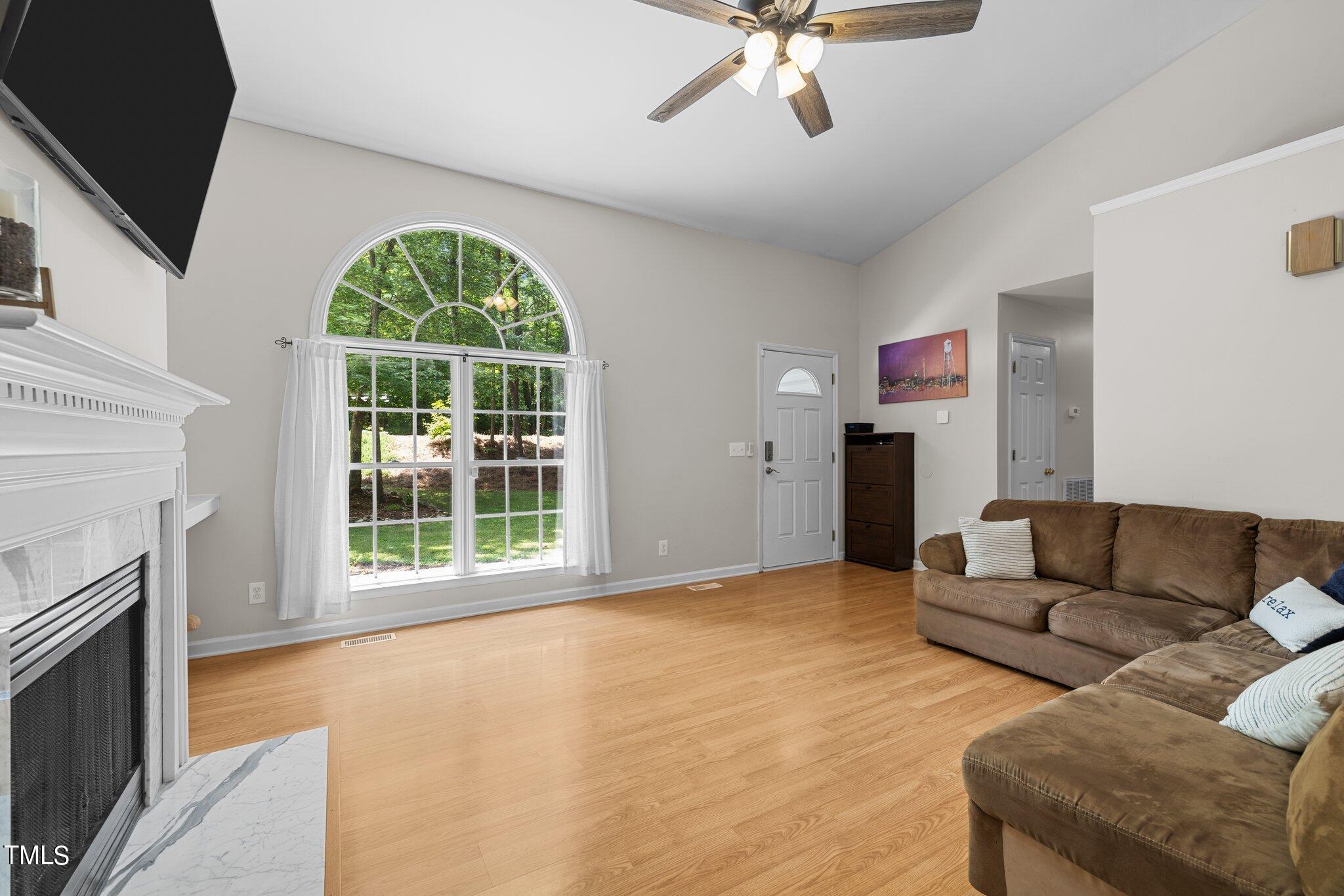 7031 Calais Drive Durham, NC 27712 - Photo 9 of 48 a living room with furniture and a fireplace