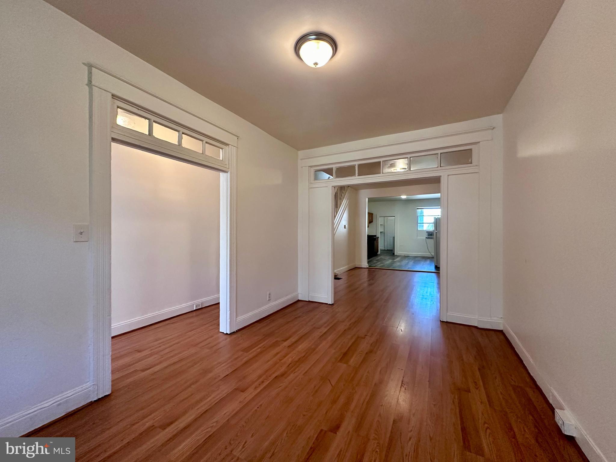 2770 The Alameda Baltimore, MD 21218 - Photo 12 of 33 wooden floor in an empty room with a window