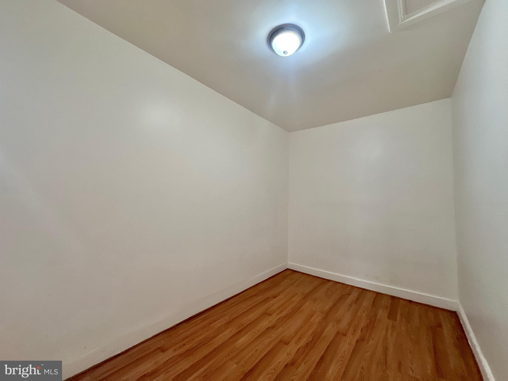 2770 The Alameda Baltimore, MD 21218 - Photo 13 of 33 a view of an empty room with wooden floor