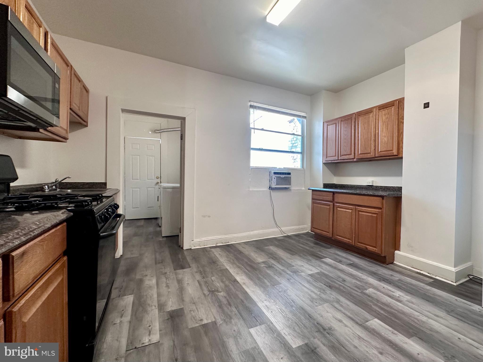 2770 The Alameda Baltimore, MD 21218 - Photo 17 of 33 a kitchen with a stove and a microwave