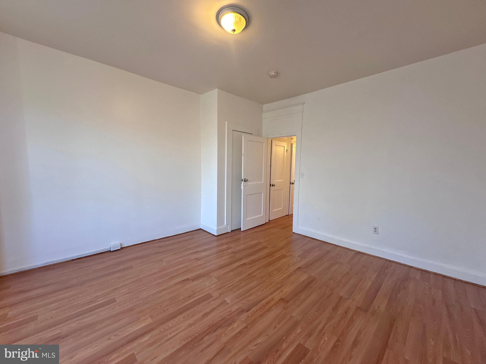 2770 The Alameda Baltimore, MD 21218 - Photo 18 of 33 a view of an empty room and wooden floor