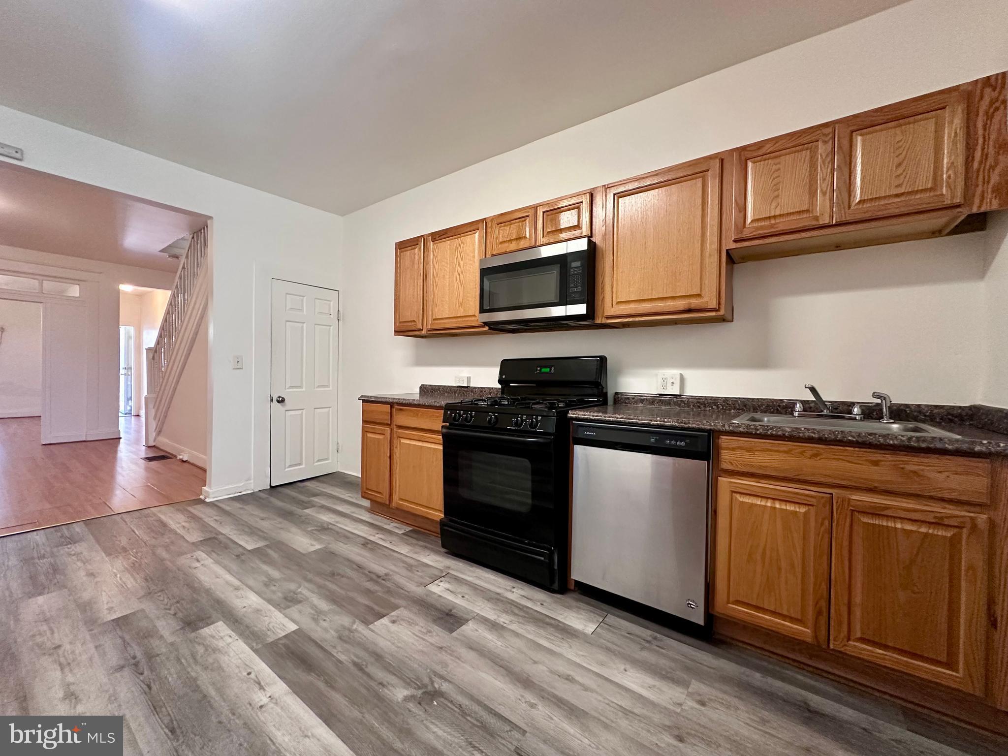 2770 The Alameda Baltimore, MD 21218 - Photo 6 of 33 a kitchen with stainless steel appliances granite countertop a stove and a sink
