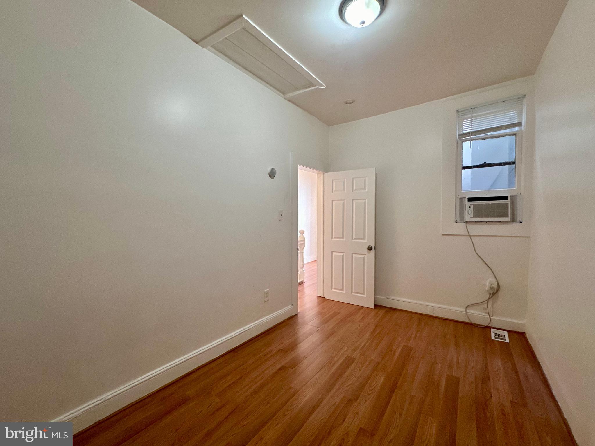 2770 The Alameda Baltimore, MD 21218 - Photo 7 of 33 a view of a room with wooden floor and a window