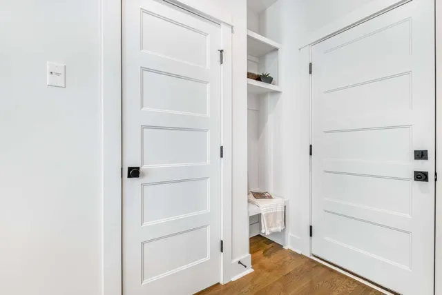 a view of walk in closet with empty racks