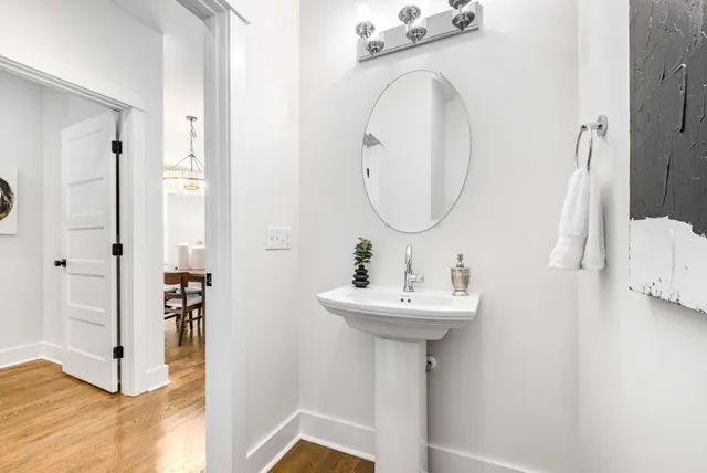 a bathroom with a sink a mirror and shower