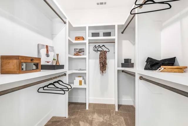 a kitchen with stainless steel appliances a refrigerator and a stove