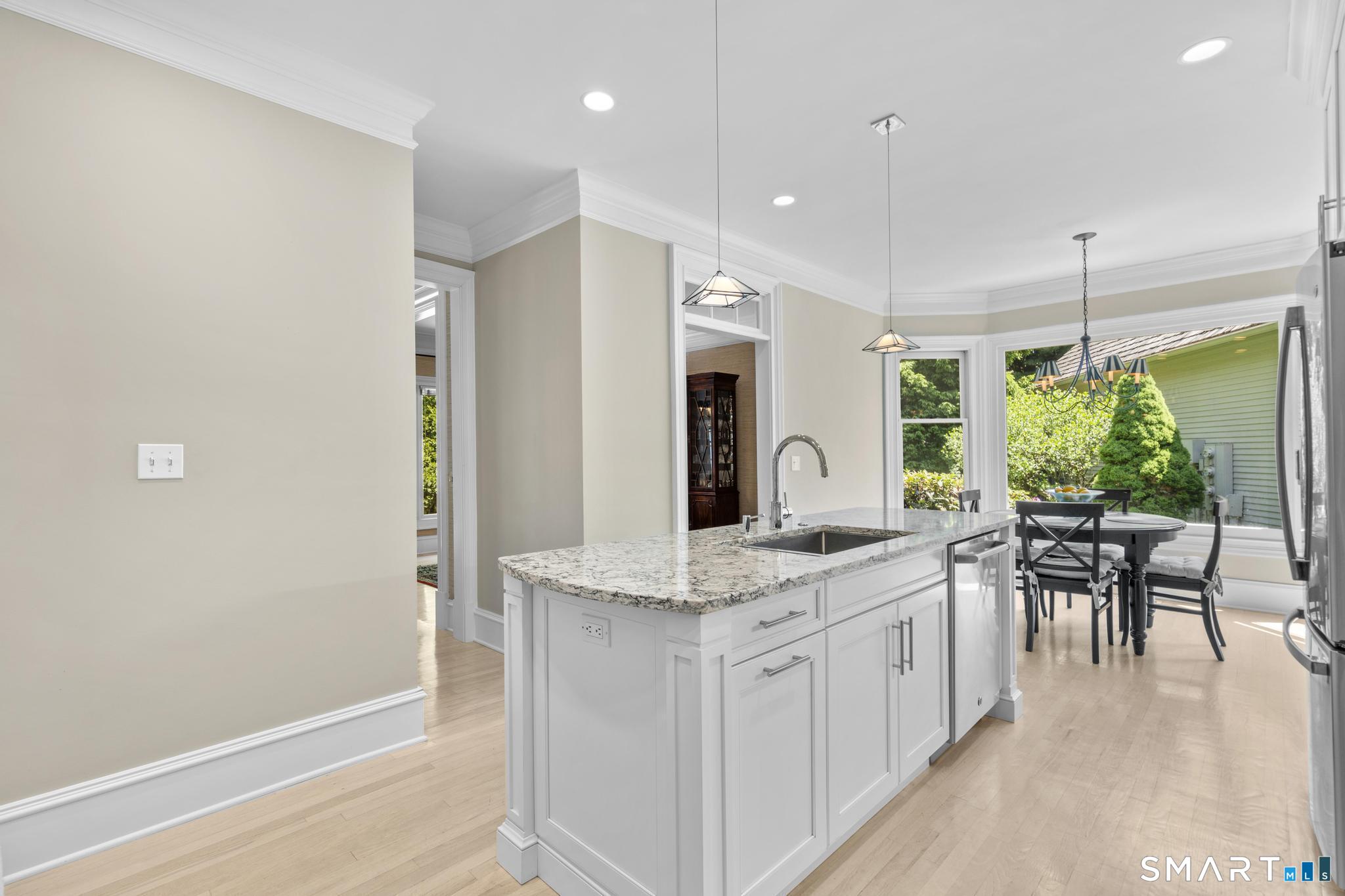 130 Stillson Road, Unit 130 Fairfield, CT 06825 - Photo 8 of 38 Updated kitchen with stainless steel appliance, granite countertops, and eating area flows effortlessly into formal dining room making entertaining a breeze