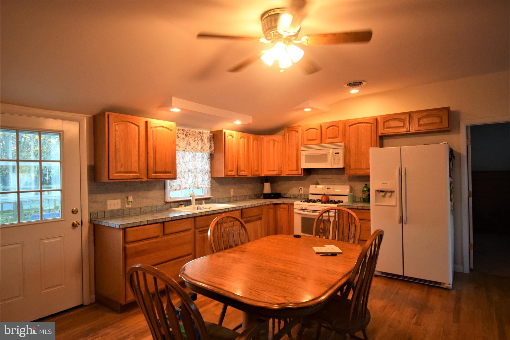 15500 Cutoff Road Henderson, MD 21640 - Photo 7 of 29 Wood floors and cabinets