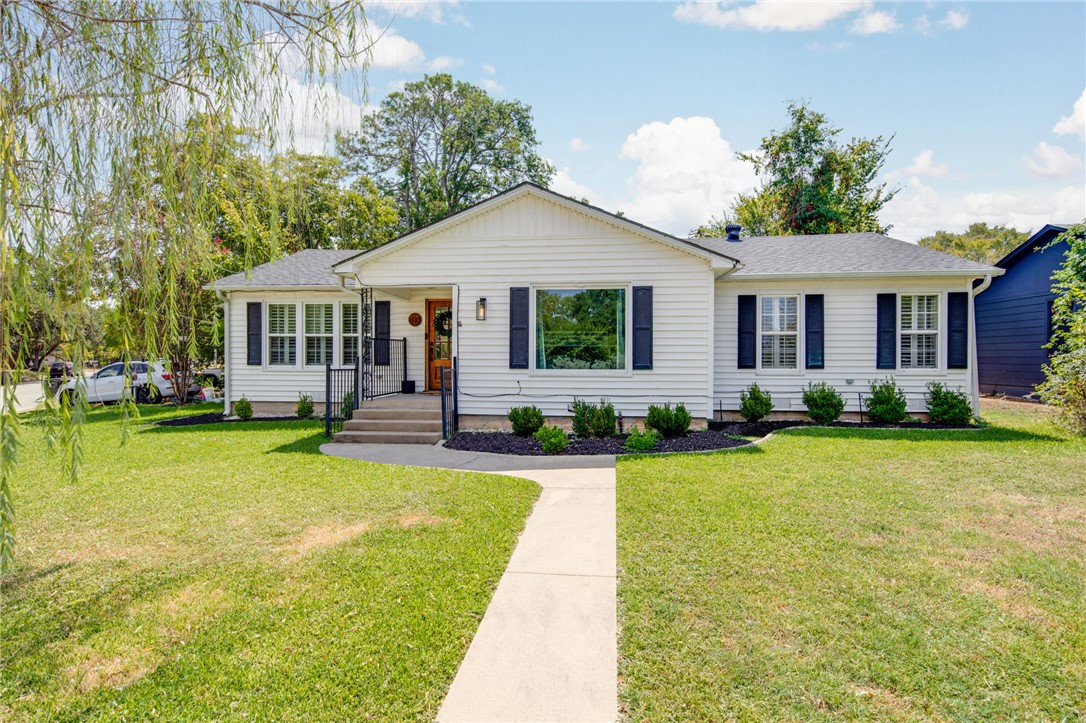 833 Enfield Street Bryan, TX 77802 - Photo 1 of 33 a view of a house with swimming pool and a yard