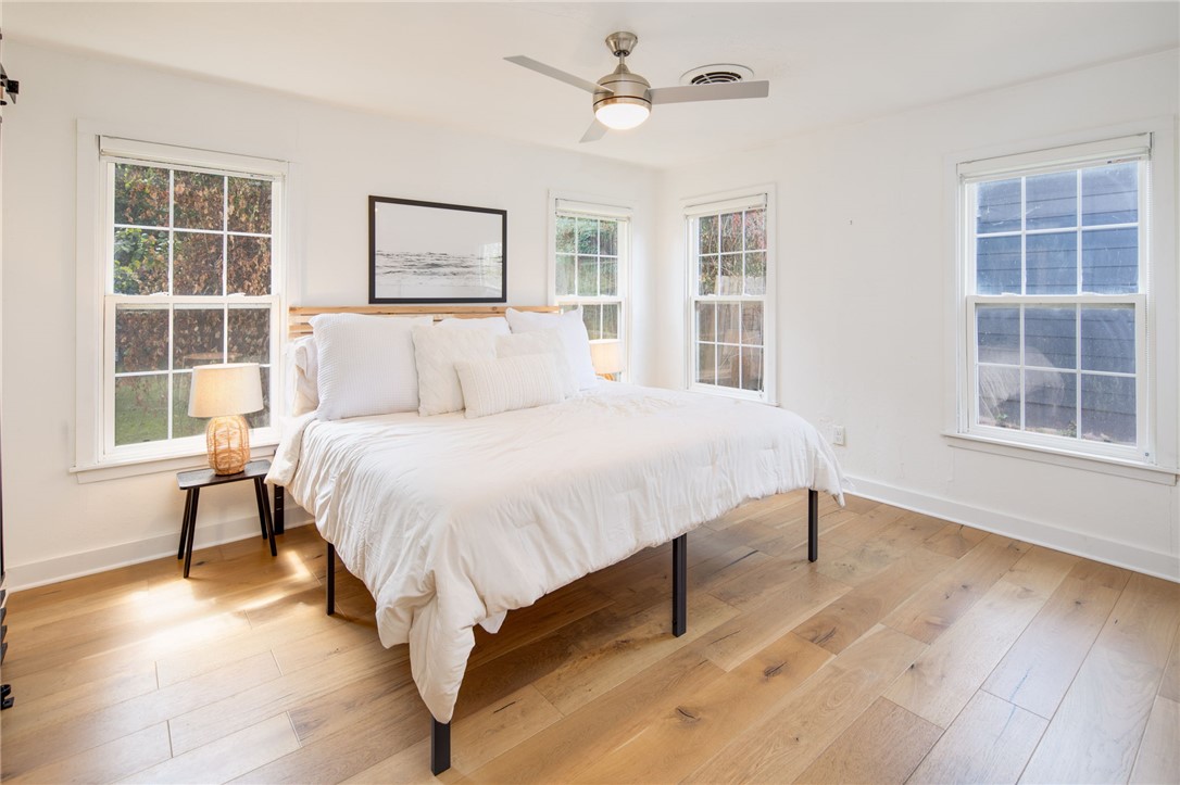 833 Enfield Street Bryan, TX 77802 - Photo 16 of 33 a bedroom with a large bed and a window