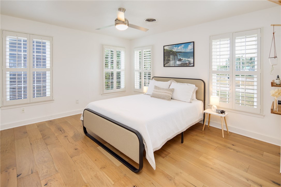 833 Enfield Street Bryan, TX 77802 - Photo 22 of 33 a bedroom with a large bed and a window