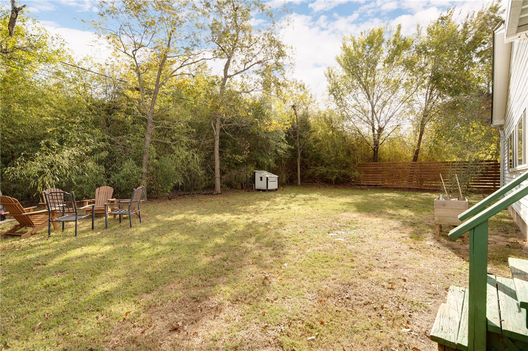 833 Enfield Street Bryan, TX 77802 - Photo 28 of 33 a view of a garden with a bench
