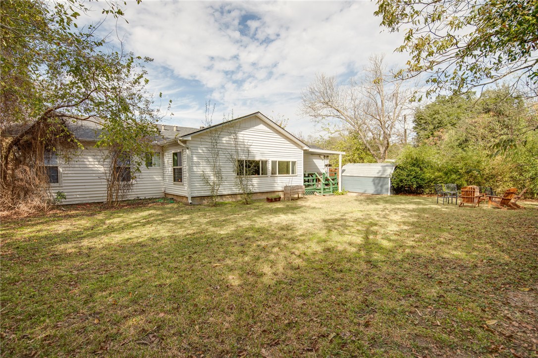 833 Enfield Street Bryan, TX 77802 - Photo 29 of 33 a front view of a house with a yard and garage