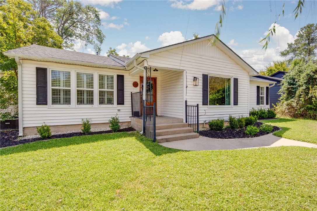 833 Enfield Street Bryan, TX 77802 - Photo 3 of 33 front view of a house with a yard