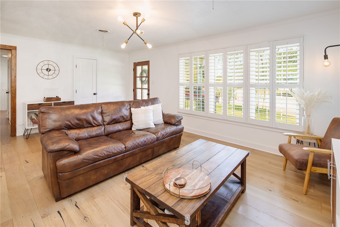 833 Enfield Street Bryan, TX 77802 - Photo 5 of 33 a living room with furniture and a large window