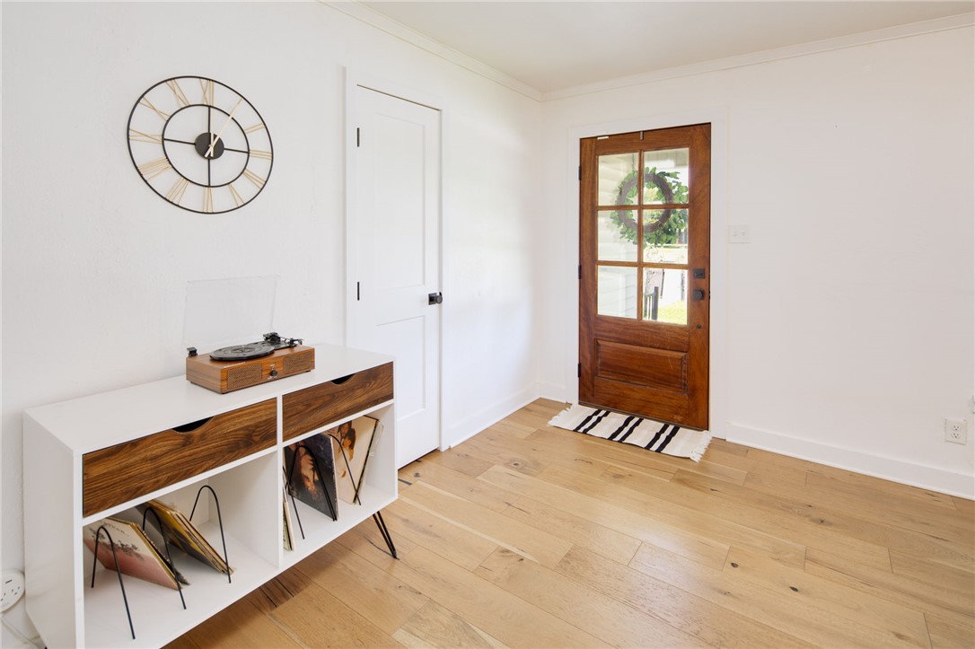 833 Enfield Street Bryan, TX 77802 - Photo 6 of 33 a view of a room with wooden floor and white walls