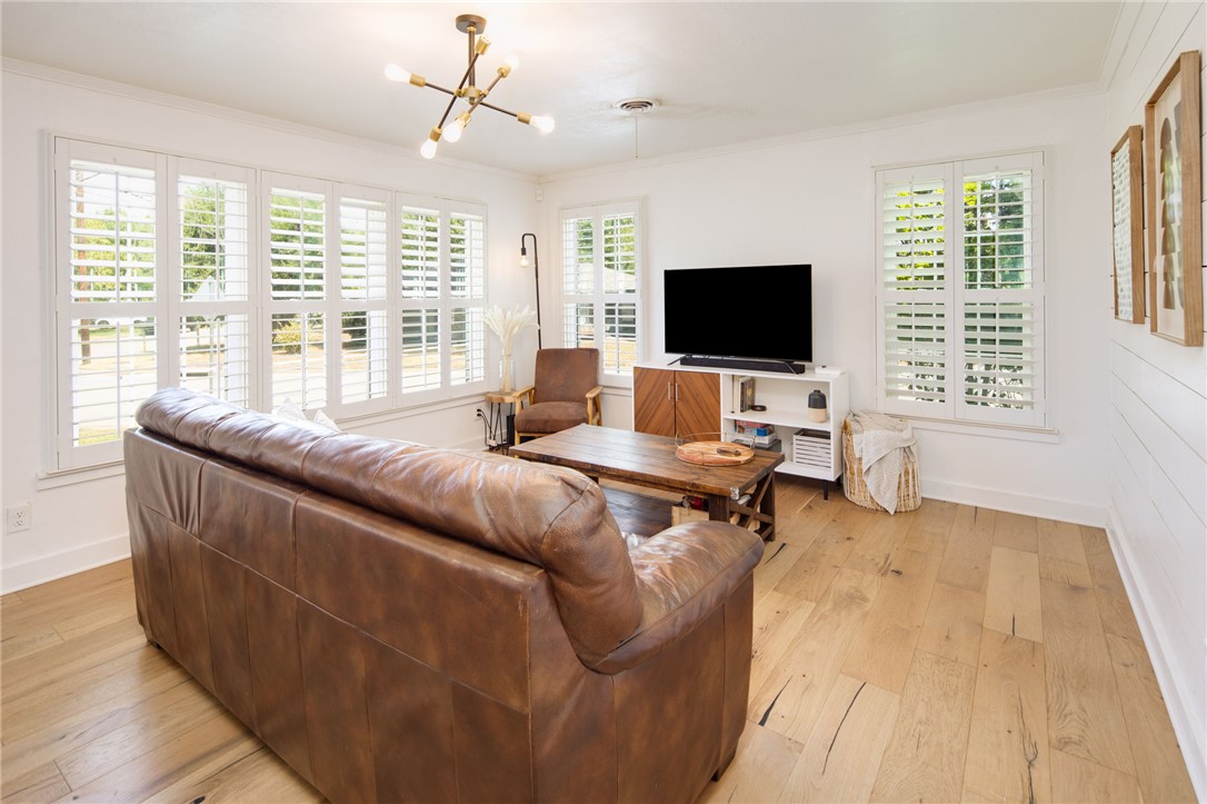 833 Enfield Street Bryan, TX 77802 - Photo 8 of 33 a living room with furniture and a flat screen tv