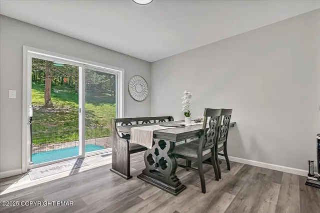 a kitchen with stainless steel appliances granite countertop a sink a stove top oven a counter space and cabinets