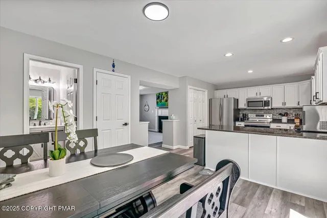 a stove top oven sitting inside of a kitchen