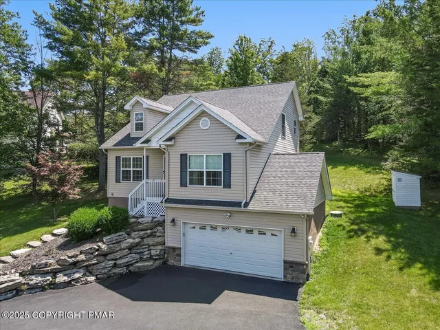 front view of a house with a garden
