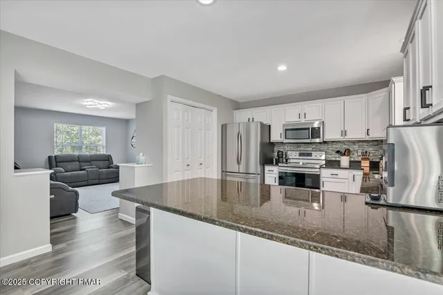 a bedroom with a bed and a mirror