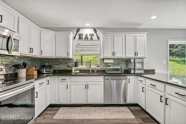 a bathroom with a double vanity sink and a mirror