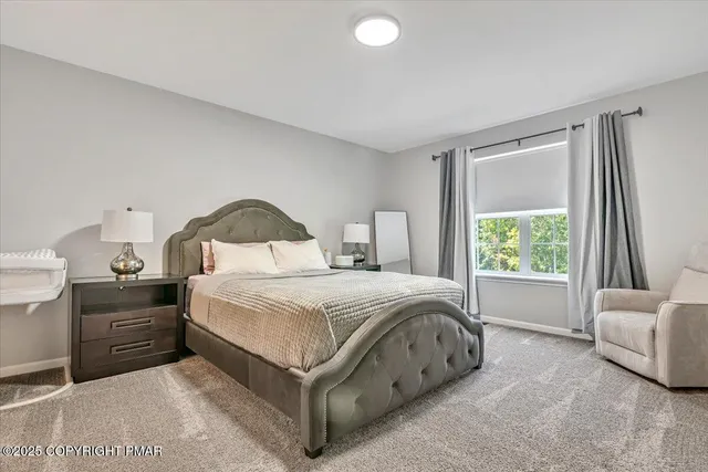 a bathroom with a toilet a sink and a mirror