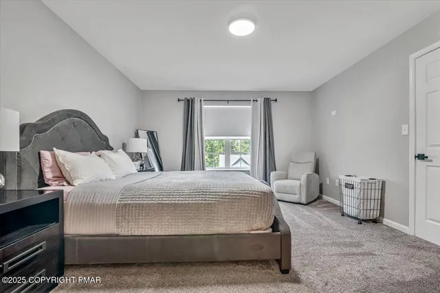 a bathroom with a toilet a sink and a mirror