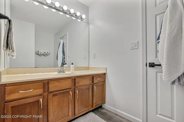a living room with furniture a couch and a chandelier