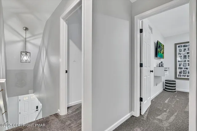 a front view of a house with a yard garage and outdoor seating