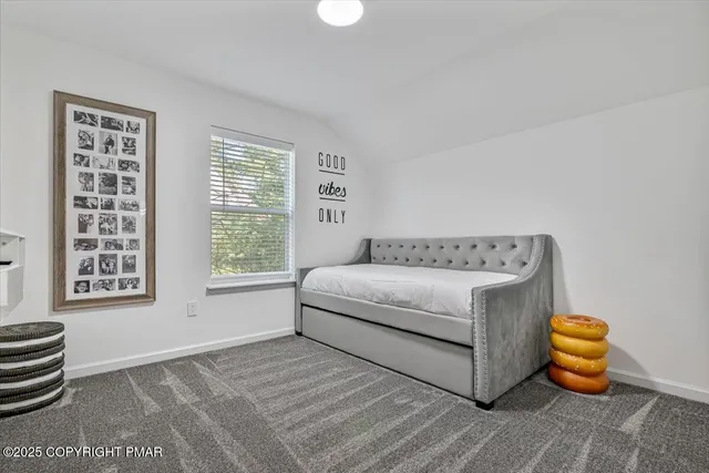 a view of backyard with a garden and deck