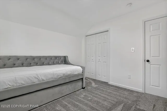 an aerial view of a house with a yard basket ball court and outdoor seating