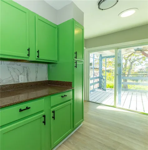 a kitchen with a sink and a large window