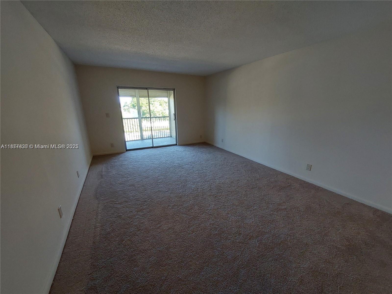 257 South Cypress Road, Unit 438 Pompano Beach, FL 33060 - Photo 4 of 20 a view of a big room with windows